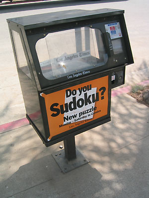 LA Times newspaper box with Sudoku puzzle advert